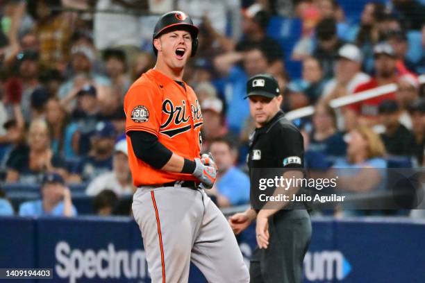 Ryan Mountcastle of the Baltimore Orioles reacts after hitting a go ahead 2-RBI single against the Tampa Bay Rays in the 11th inning at Tropicana...