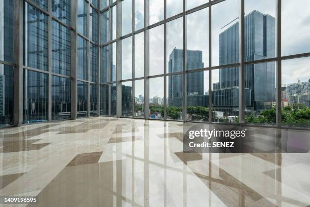 view from inside looking out through big windows - building lobby stock pictures, royalty-free photos & images