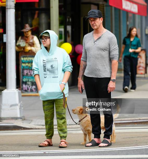 Dylan McDermott walks with Charlotte Rose McDermott and dog Otis on July 16, 2022 in New York City.