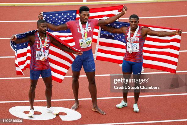 Bronze medalist Trayvon Bromell of Team United States, gold medalist Fred Kerley of Team United States, and silver medalist Marvin Bracy of Team...