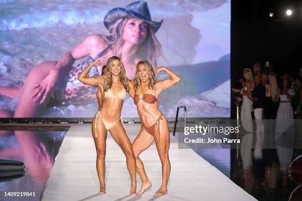 Katie Austin and Denise Austin walk the runway for Sports Illustrated Swimsuit Runway Show During Paraiso Miami Beach on July 16, 2022 in Miami...