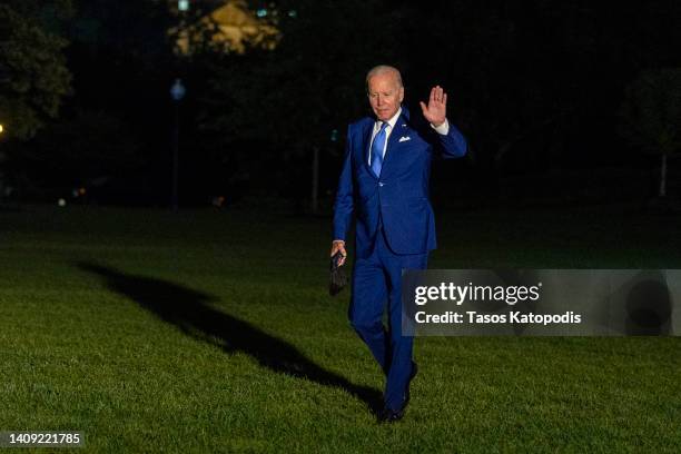 President Joe Biden walks off Marine One on the South Lawn of the White House on July 16, 2022 in Washington, DC. President Biden just returned from...