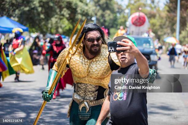 Cosplayer Adam Kyron Murillo as Aquaman marches in the 2022 San Diego Pride Parade on July 16, 2022 in San Diego, California.