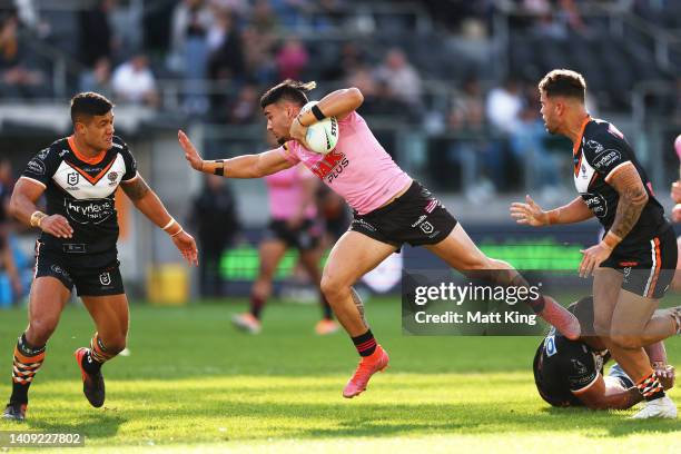 Taylan May of the Panthers is tackled during the round 18 NRL match between the Wests Tigers and the Penrith Panthers at CommBank Stadium, on July 17...