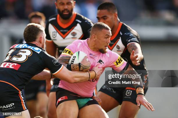 James Fisher-Harris of the Panthers is tackled during the round 18 NRL match between the Wests Tigers and the Penrith Panthers at CommBank Stadium,...