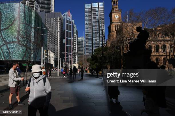 Pedestrians and shoppers make their way through the central business district on July 17, 2022 in Sydney, Australia. Health authorities are...