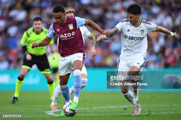 Aaron Ramsey of Aston Villa dribbles the ball under pressure during the 2022 Queensland Champions Cup match between Aston Villa and Leeds United at...