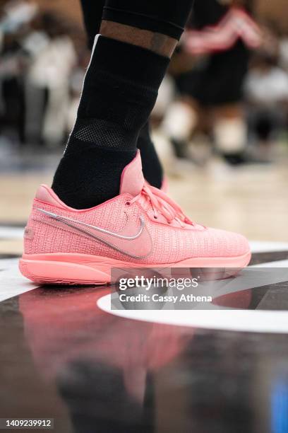 LeBron James shows off his new sneaker, the LeBron 20, at the Drew League Pro-Am on July 16, 2022 in Los Angeles, California.