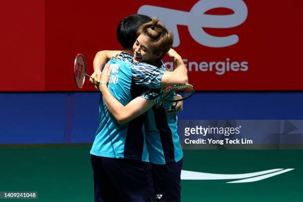 Dechapol Puavaranukroh and Sapsiree Taerattanachai of Thailand celebrate match point against Wang Yi Lyu and Huang Dong Ping of China in their mixed...