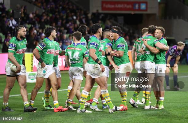 The Raiders celebrate after Jack Wighton scores a try during the round 18 NRL match between the Melbourne Storm and the Canberra Raiders at AAMI...