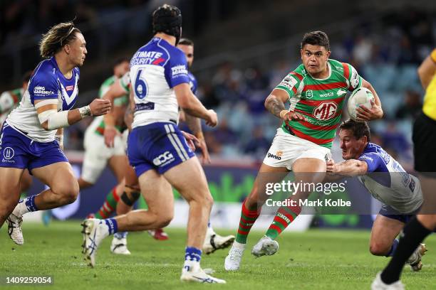 Latrell Mitchell of the Rabbitohs is tackled during the round 18 NRL match between the Canterbury Bulldogs and the South Sydney Rabbitohs at Stadium...