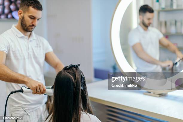 woman at hairdresser - female curler stock pictures, royalty-free photos & images
