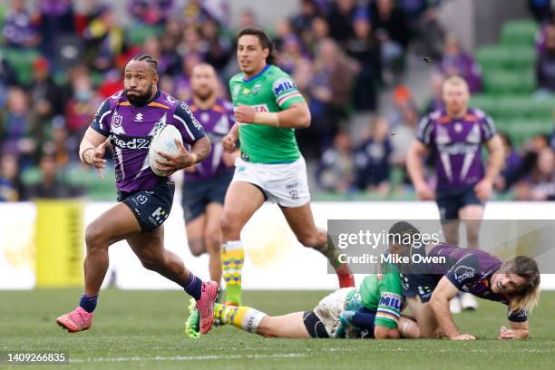 Justin Olam of the Storm runs with the ball during the round 18 NRL match between the Melbourne Storm and the Canberra Raiders at AAMI Park, on July...