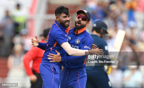 India bowler Mohammed Siraj is congratulated by Virat Kohli after taking the wicket of Jonny Bairstow during the 3rd Royal London Series One Day...