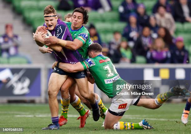 Alec MacDonald of the Storm is tackled during the round 18 NRL match between the Melbourne Storm and the Canberra Raiders at AAMI Park, on July 17 in...