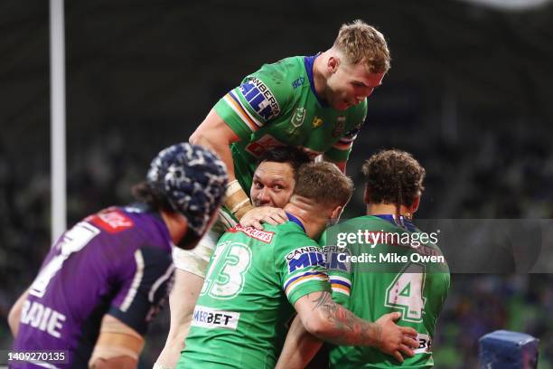 The Raiders celebrate after Jordan Rapana of the Raiders scored a try which was later disallowed during the round 18 NRL match between the Melbourne...