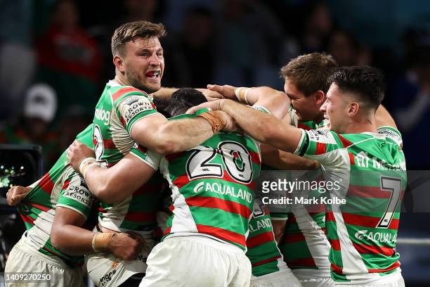 Alex Johnston of the Rabbitohs celebrates with his team mates after scoring a try during the round 18 NRL match between the Canterbury Bulldogs and...
