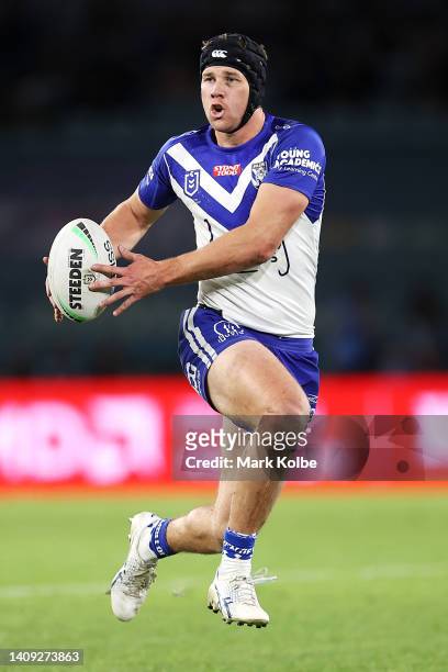 Matt Burton of the Bulldogs runs with the ball during the round 18 NRL match between the Canterbury Bulldogs and the South Sydney Rabbitohs at...