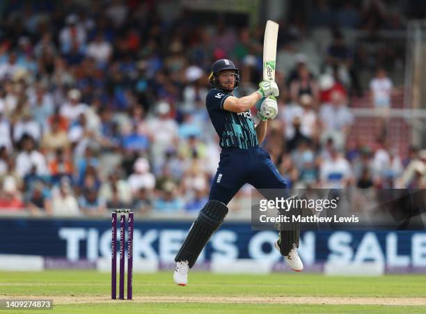 Jos Buttler of England hits the ball towards the boundary during the 3rd Royal London Series One Day International between England and India at...