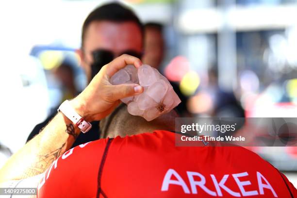 Detailed view of Hugo Hofstetter of France and Team Arkéa - Samsic cools down to refresh itself with ice cubes prior to the 109th Tour de France...