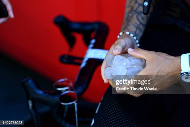 Detailed view of Hugo Hofstetter of France and Team Arkéa - Samsic cools down to refresh itself with ice cubes prior to the 109th Tour de France...