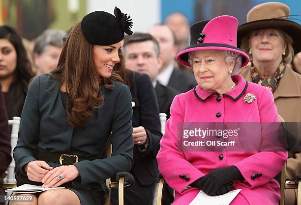 Queen Elizabeth II and Catherine, Duchess of Cambridge watch a fashion show at De Montfort University on March 8, 2012 in Leicester, England. The...