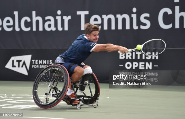 Martin De La Puente of Spain plays against Joachim Gerard of Belgium in the British Open mens singles final match during day six of the British Open...