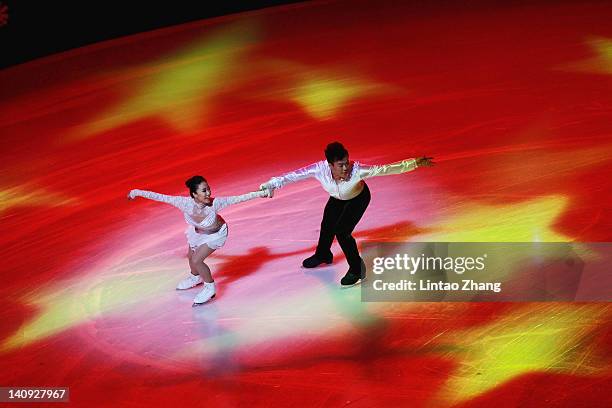 China's first Olympic champion figure skaters Shen Xue and Zhao Hongbo perform on the ice during the opening ceremony of ISU World Short Track Speed...