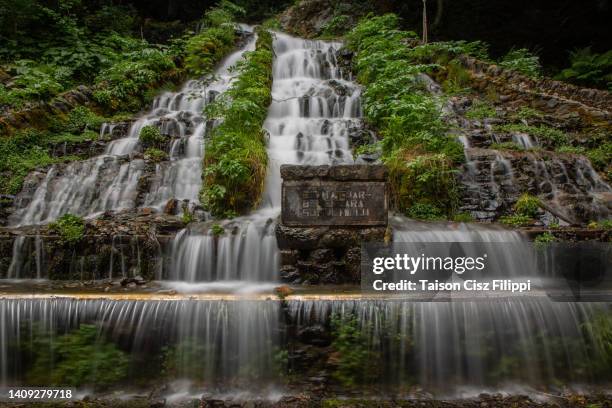 amazing waterfalls surrounded by green trees and mountains - gaia filippi stock pictures, royalty-free photos & images