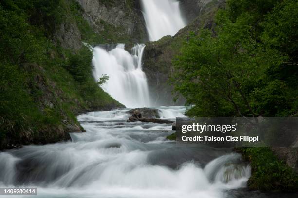 amazing waterfalls surrounded by green trees and mountains - gaia filippi stock pictures, royalty-free photos & images