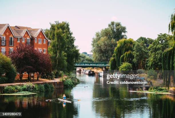 woman canoeing on river lea in london, uk - walthamstow stock pictures, royalty-free photos & images
