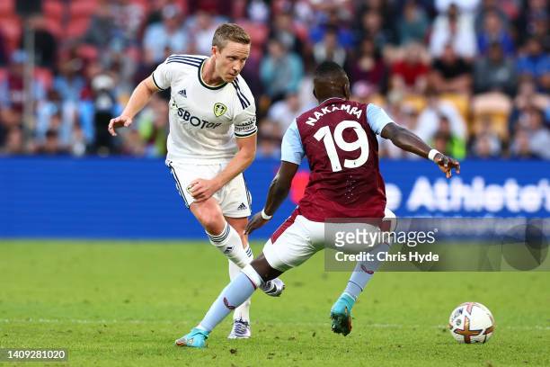 Adam Forshaw of Leeds United kicks during the 2022 Queensland Champions Cup match between Aston Villa and Leeds United at Suncorp Stadium on July 17,...