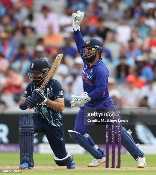 Rishabh Pant of India celebrates catching Moeen Ali of England off the bowling of Ravindra Jadeja of India during the 3rd Royal London Series One Day...