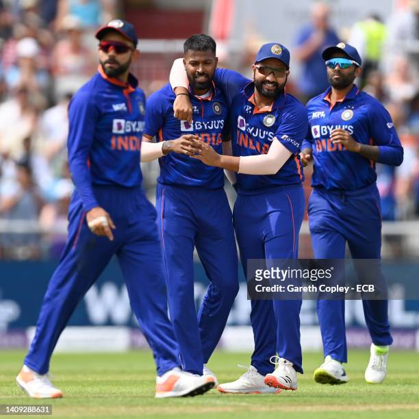 Hardik Pandya of India celebrates with captain Rohit Sharma after dismissing England captain Jos Buttler during the 3rd Royal London Series One Day...
