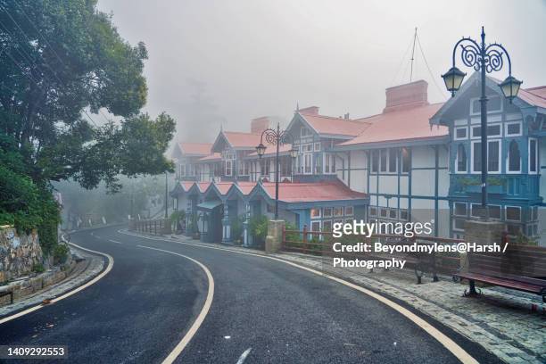the mall road image in the early foggy morning with beautiful architecture. - shimla stock pictures, royalty-free photos & images