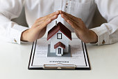 The concept of contracting a home insurance agreement.