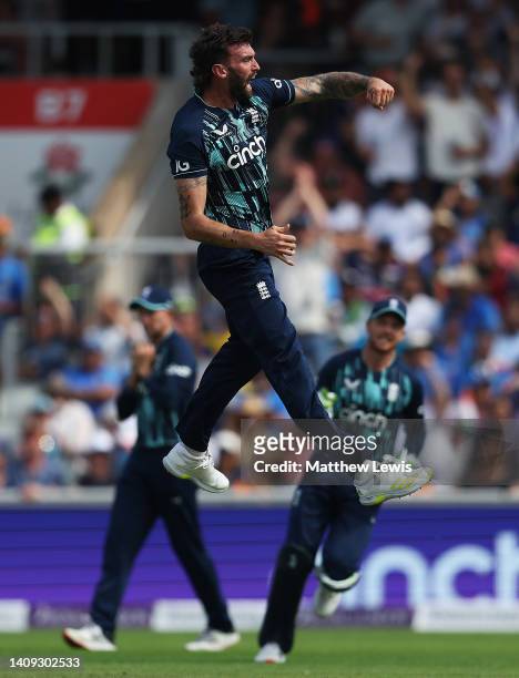 Reece Topley of England celebrates the wicket of Rohit Sharma of India, after he was caught by Joe Root of England during the 3rd Royal London Series...