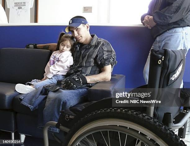 Spec Joshua Stein with daughter Rachel at the Brooke Army Medical Center on January 28, 2007. Both of his legs were severed when the Bradley fighting...