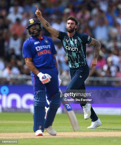 England bowler Reece Topley celebrates after taking the wicket of Rohit Sharma during the 3rd Royal London Series One Day International match between...