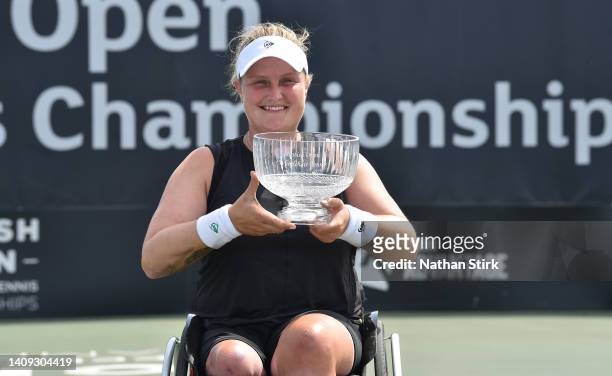Aniek Van Koot of Netherlands poses with the British Open woman's singles trophy after beating Lucy Shuker of Great Britain during day six of the...