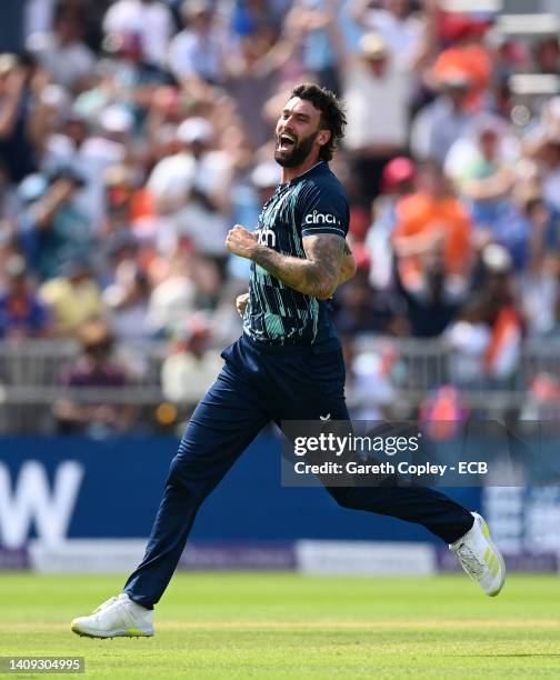 Reece Topley of England celebrates after dismissing Virat Kohli of India during the 3rd Royal London Series One Day International match between...