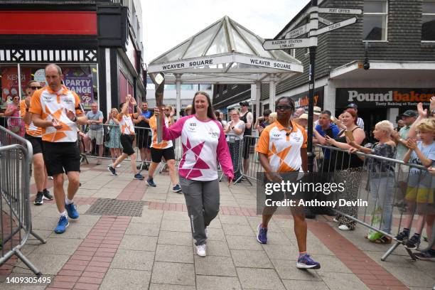 Baton bearer Ruth Williams holds the Queen's Baton during the Birmingham 2022 Queen's Baton Relay during a visit to the town centre on July 17, 2022...