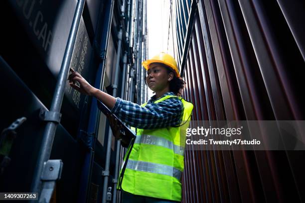 black female worker working in commercial dock - customs officer stock pictures, royalty-free photos & images