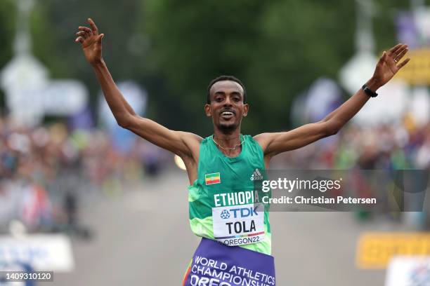 Tamirat Tola of Team Ethiopia celebrates winning gold in the Men's Marathon on day three of the World Athletics Championships Oregon22 at Hayward...