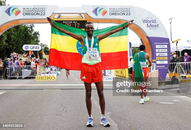 Tamirat Tola of Team Ethiopia celebrates winning gold in the Men's Marathon on day three of the World Athletics Championships Oregon22 at Hayward...