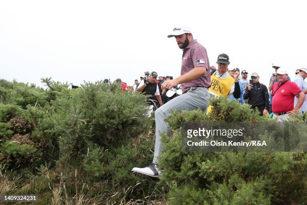Cameron Young of the United States moves through hedging to find their ball during Day Four of The 150th Open at St Andrews Old Course on July 17,...