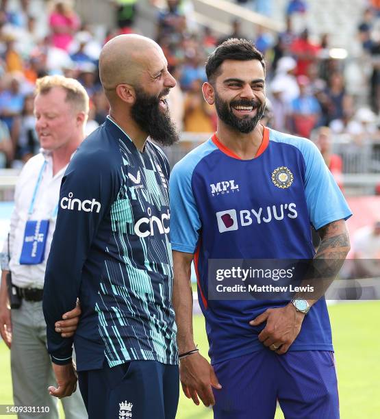 Moeen Ali of England and Virat Kohli of India share a joke, after during the 3rd Royal London Series One Day International between England and India...