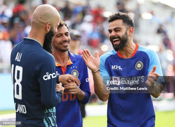 Moeen Ali of England and Virat Kohli and Yuzvendra Chahal of India share a joke, after during the 3rd Royal London Series One Day International...
