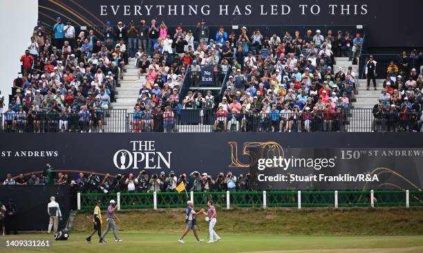 Cameron Smith of Australia shakes hands with their Caddie on the 18th green during Day Four of The 150th Open at St Andrews Old Course on July 17,...