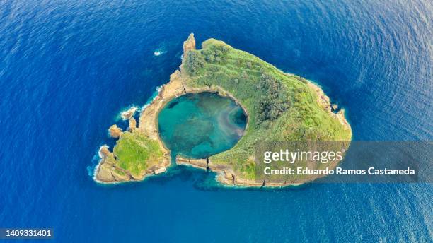 sao miguel island, azores, portugal. top view of islet of vila franca do campo. azores aerial panoramic view. crater of an old underwater volcano. bird eye view - azores stock pictures, royalty-free photos & images